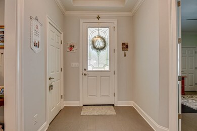 Wide foyer with trey ceiling