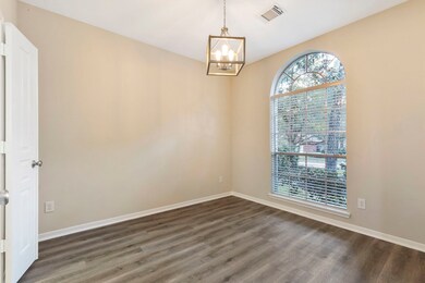 An alternate view of the formal dining room with access to the kitchen.