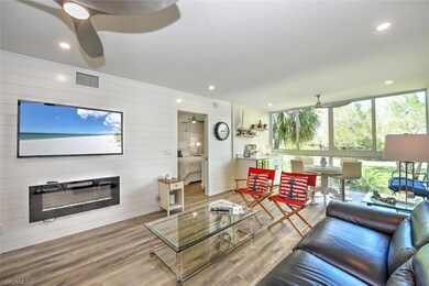 Living area featuring floor to ceiling windows, sh