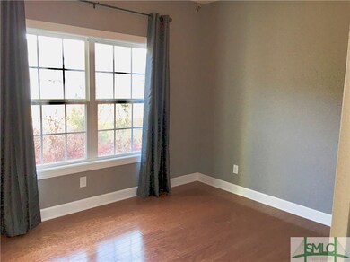 main floor flex room perfect for workout area/office/playroom/spare bedroom and overlooks the patio