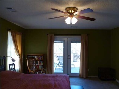 Master bedroom opens to wood deck