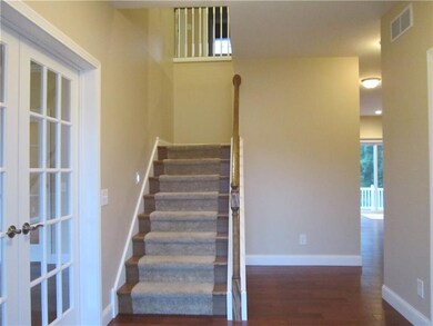 Main Entry.  Den is through the doors to the left.