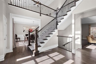 Completely redone staircase leading to vaulted loft and finish lower level.