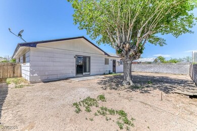 Rear view of house featuring fence