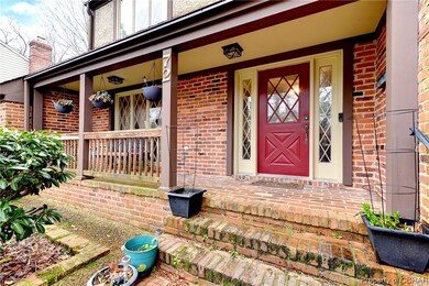 Entrance to property featuring covered porch