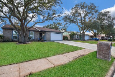 Charming curb appeal with a well-manicured lawn an