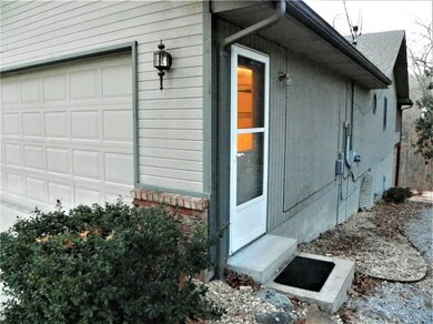 A side entry door to the garage makes for easy access, and a wide, very simple path to the backyard.