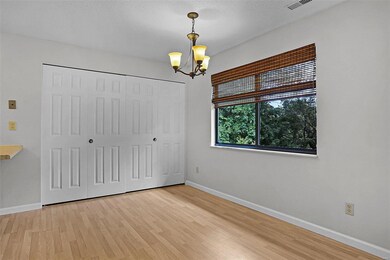 Dining area overlooking the wooded lot.