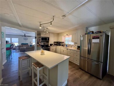 Kitchen featuring stainless steel appliances, ligh