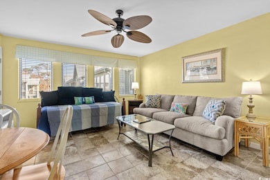 Living area featuring a ceiling fan