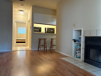 Unfurnished living room with wood finished floors