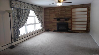 The spacious living room offers a large window for