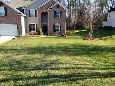 Front view of property with yard recently mowed.