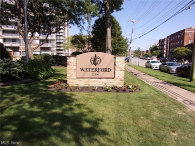 Community / neighborhood sign featuring a yard