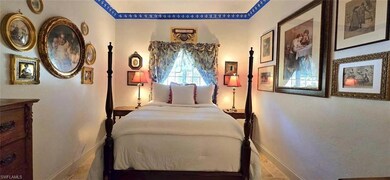 Bedroom with baseboards and tile patterned flooring