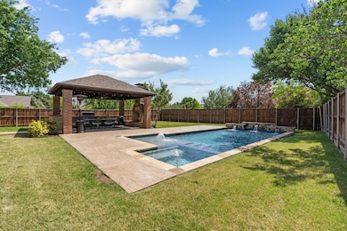 View of swimming pool with a gazebo, a fenced in p