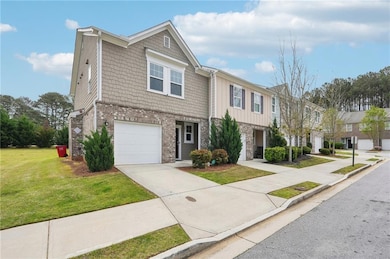 Townhome / multi-family property featuring brick s
