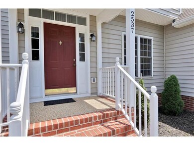 Covered, brick front porch