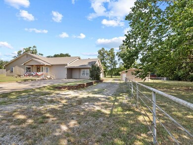 Ranch-style home featuring a front yard