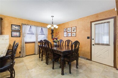 A formal dining room table and chairs fit easily i