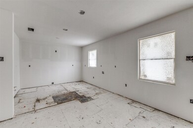 The living room with view of the front door. The k