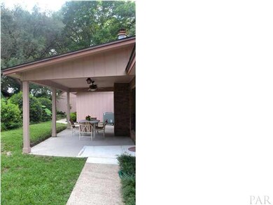 Back yard showing covered patio.