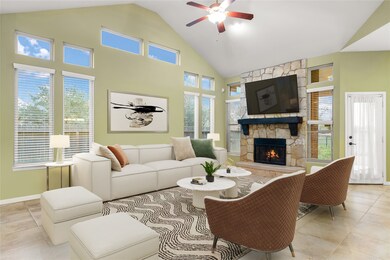 Gather the family and guests together in your lovely living room! Featuring high ceilings, recessed lighting, dark stained ceiling fan, custom paint, gorgeous floors, stone fireplace with mantel and large windows that provide plenty of natural lighting throughout the day.

