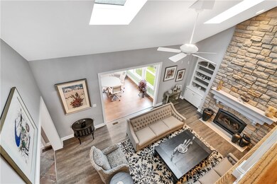 A view of the living room from the upper hallway.
