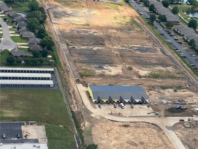 Grand Slam Business Park is a premier mixed-use development in Fort Smith. 17.72 acres, the property offers three 1.1-acre lots, 12 flexible buildings, fiber-optic connectivity, LED signage, and new road access with 20,000+ daily vehicle exposure. Projected returns include $1.836M annual rental income, $1M+ lot sales, and a 15.3% ROI. With proximity to Fort Smith Regional Airport and regional growth fueled by military expansion, this is a rare investment opportunity.