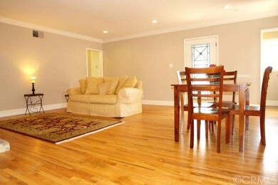 Large Living Room with Crown Molding, recessed lig