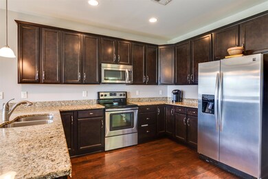 Large kitchen with granite countertops and tons of storage. Can you see yourself creating culinary masterpieces in this fantastic kitchen?
