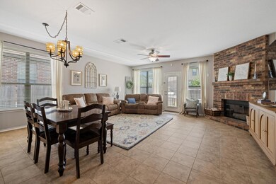 Dining space with light tile patterned floors, a 