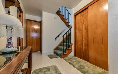 The foyer leads straight back to a laundry room or