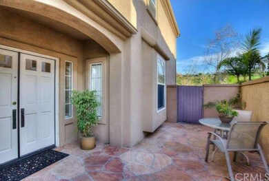 Beautiful double door entry with stone hardscaping