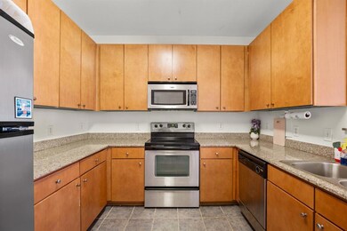 Kitchen featuring appliances with stainless steel