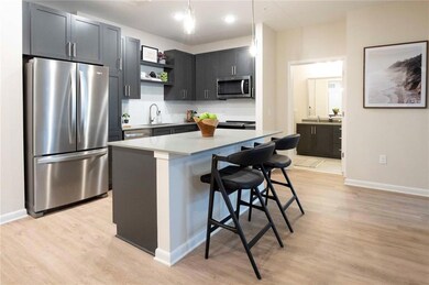 Kitchen featuring a breakfast bar, stainless steel
