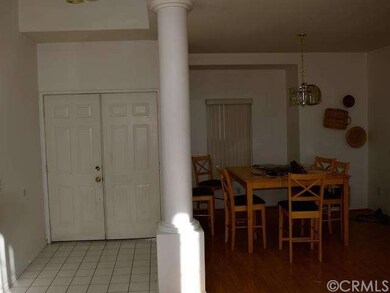 Double-door entry, formal dining room.