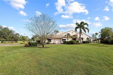 View of front of property with a garage, a lanai, 
