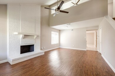 Step inside this move-in ready home! Floor to ceiling painted brick fireplace and sprawling luxury vinyl plank flooring provide a blank canvas to add your personal touches to! Soaring ceiling gives a grand first impression. The updated windows allow 