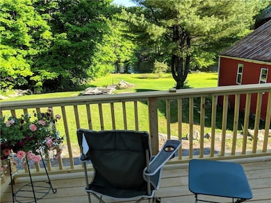 Back Deck overlooking lush yard and...