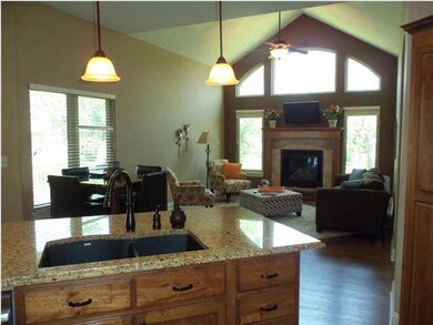 Hearth room off kitchen has lake view, handsomely 