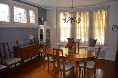 Dining room with bay window and stained glass wind