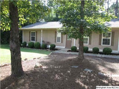 Enjoy the covered front porch which runs the entir