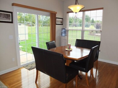 Dinette with hardwood floor.