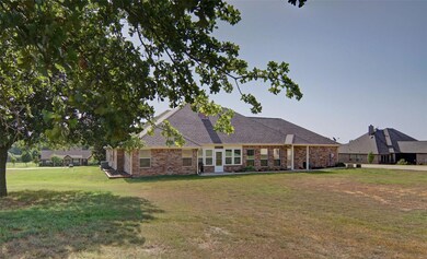 Back of house featuring a yard and central air condition unit