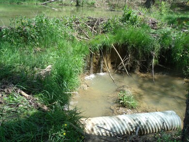 earth dam with waterfall
