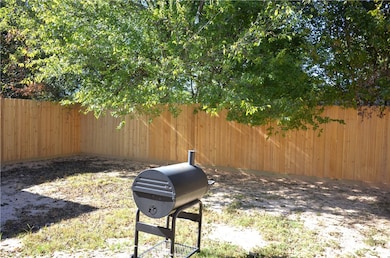 View of fenced backyard
