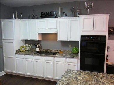 Look at all those cabinets!  Nice cooktop & prep area and microwave/oven are built-in.