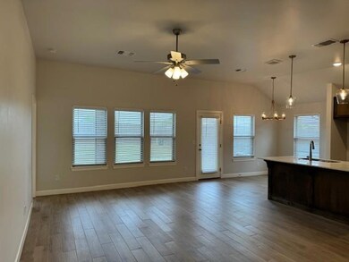 Kitchen with a wealth of natural light, ceiling fa