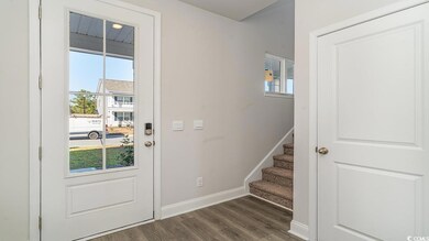 Entryway featuring dark wood-type flooring and a w